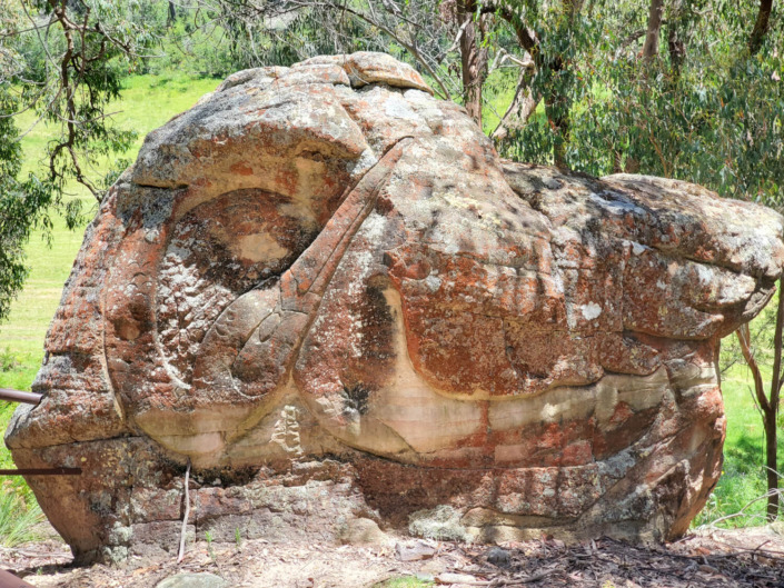 Crane Rock site specific sculpture in native sandstone after years of weathering.